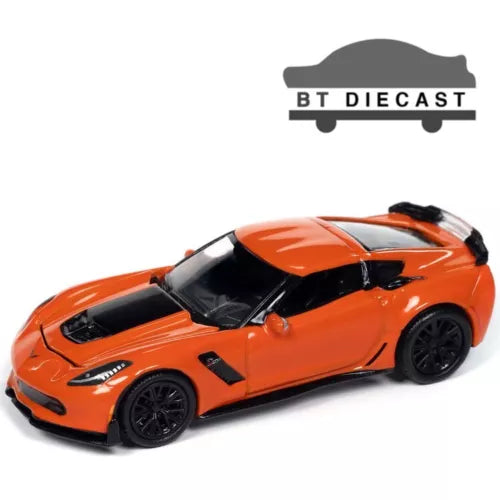 Orange diecast sports car model with black wheels and hood vents
