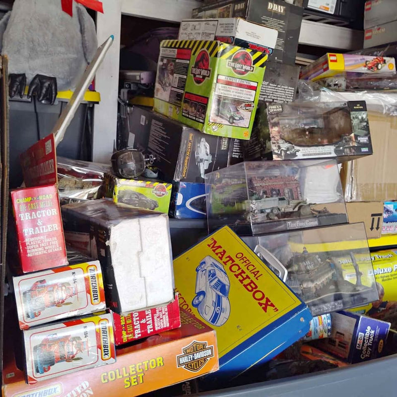 Boxed diecast car and truck model kits assortment, including orange packaging