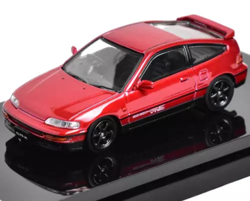 Red diecast hatchback sports car with black wheels and tinted windows