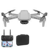 Mini quadcopter drone with 4 rotors, onboard camera, remote controller and carrying case