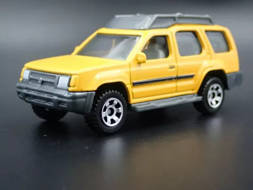 Yellow 1:64 scale SUV diecast model car with front grille detail