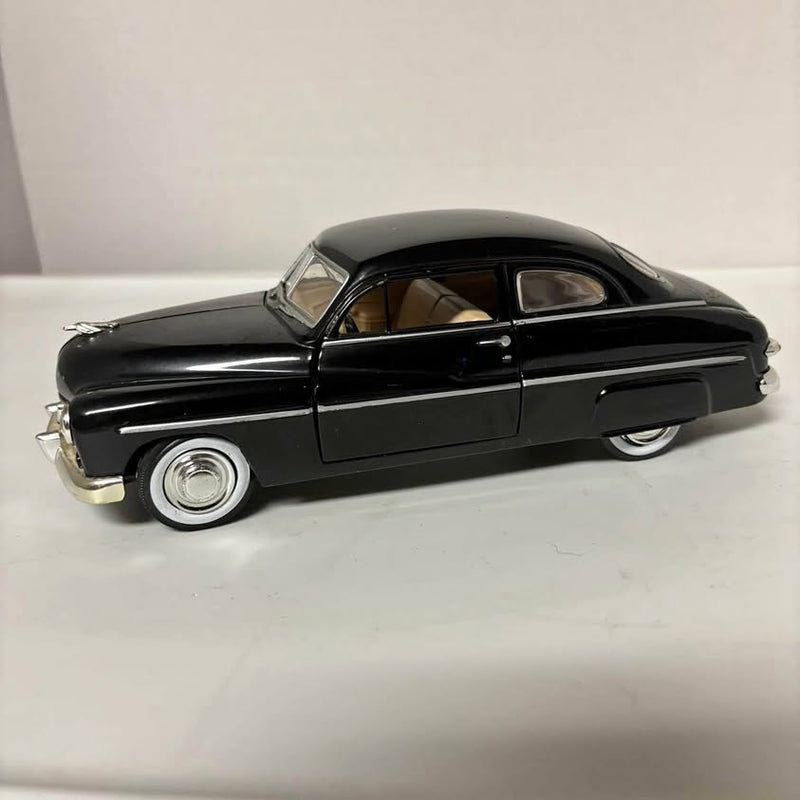 Black 1949 Mercury diecast coupe model with chrome details