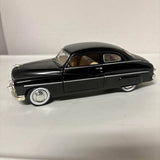 Black 1949 Mercury diecast coupe model with chrome details