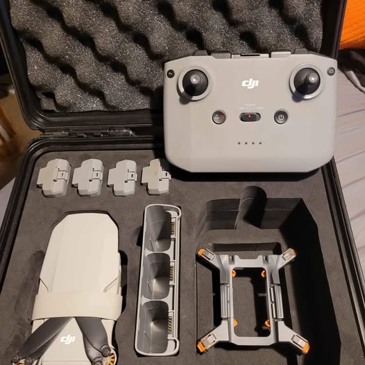 DJI Mini 2 Fly More drone kit with controller, batteries, and propellers in case