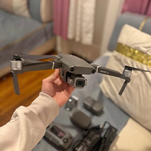 DJI Mavic 2 Pro drone with folded propellers, handheld side view