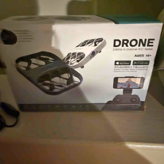 Boxed 2.4GHz quadcopter drone set with remote controller and phone holder
