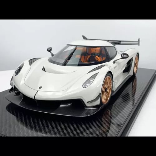 1:12 diecast race car model with white body, black front splitter and gold wheels