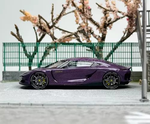 Purple sports diecast metal car model with black accents and yellow wheel details