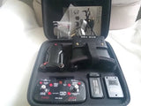 FPV drone camera set with flight goggles in hard case, controller and batteries visible