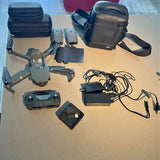 Foldable quadcopter drone with controller, batteries, cables, and carrying case