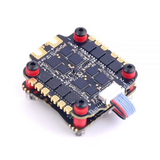 FPV flight controller stack PCB with four red mounting posts and ribbon connector