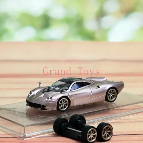 1/64 scale diecast sports car model with silver body, black hood, and gold wheels