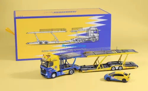 Diecast trailer truck model toy with blue cab and yellow trailer, plus car accessory