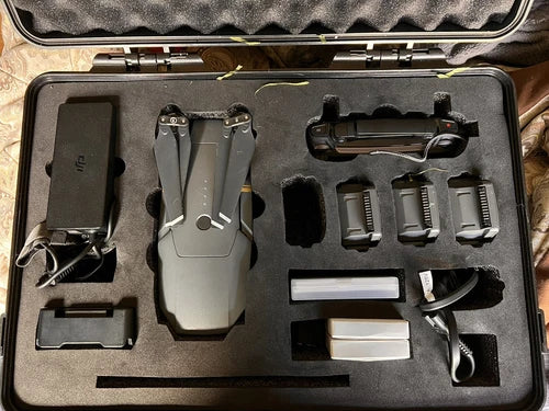 Grey DJI Mavic Pro drone with remote controller and accessories in storage case
