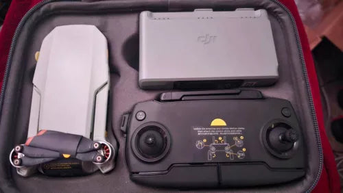 Drone controller and compact drone in a zippered storage case