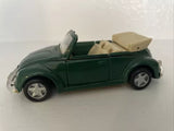 Green convertible diecast toy car with beige seats, open top