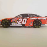1/24-scale NASCAR diecast race car, red #20 with Home Depot and black wheels