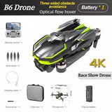 Race drone with black body and green accents, visible dual rotors and camera mount