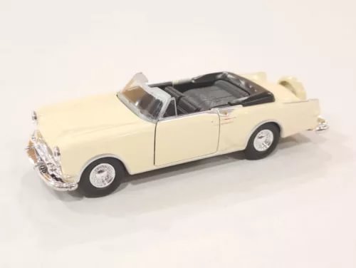 Cream convertible diecast model car with whitewall tires and chrome grille