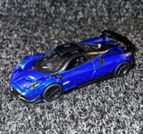 Blue 1:38 diecast model toy car with black wheels and hood vents