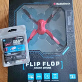 Mini flip flop stunt drone in retail box, red propellers visible through clear window