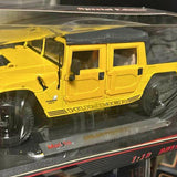 Yellow diecast Hummer SUV model, side view with HUMMER grille badge