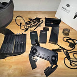DJI drone accessory kit with cables, prop guards, cases, and smartphone holder