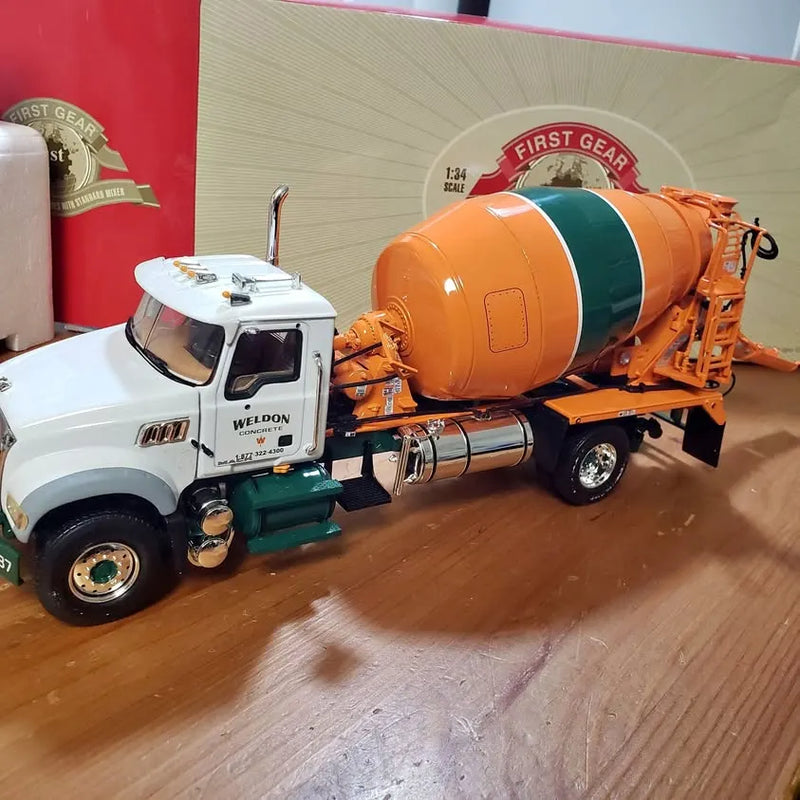 First Gear diecast metal Mack cement mixer truck with orange and green drum