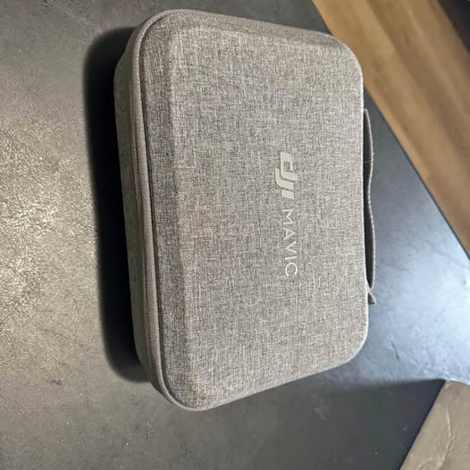 Gray fabric Mavic Mini accessory case with front logo and zipper opening