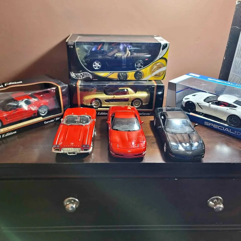 1/18 diecast Corvette car models in red, orange, white, and blue with boxes