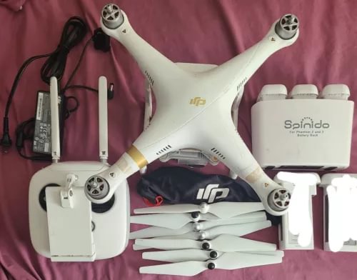 White DJI Phantom 3 4K drone with mounted camera module