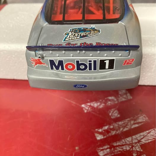 Gray diecast Ford Taurus collectible car rear with Mobil 1 and Ford badge
