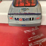 Gray diecast Ford Taurus collectible car rear with Mobil 1 and Ford badge
