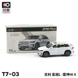 White die-cast SUV model toy car with front 3/4 view, shown beside retail box.