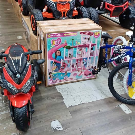 Barbie dollhouse playset box with pink interior and bikes, in retail packaging