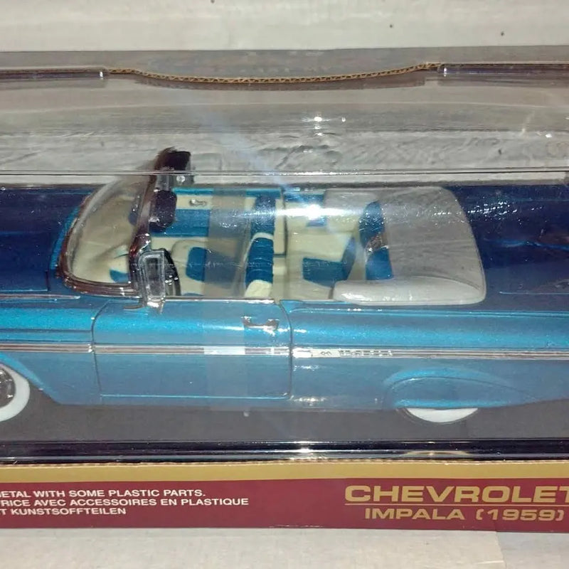 Blue 1959 Chevy Impala convertible diecast car with clear windshield and interior