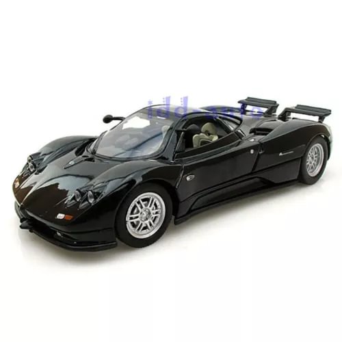 Black 1/24 diecast sports car model with open cockpit and silver spoke wheels