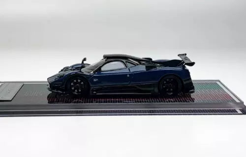 Blue racing sports diecast resin car model, side view on display base