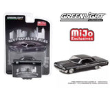Black 1964 Impala SS diecast car in blister packaging