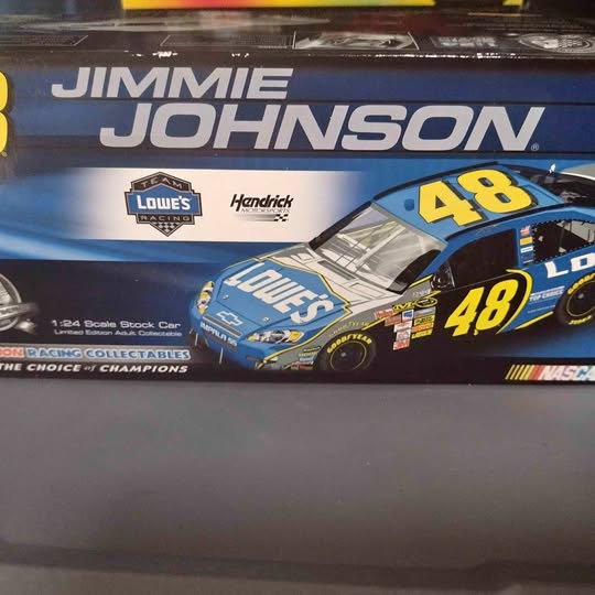 NASCAR diecast race car model in box, blue and yellow #48 car