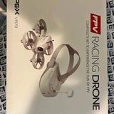 White racing drone with four propellers and compact foldable arms