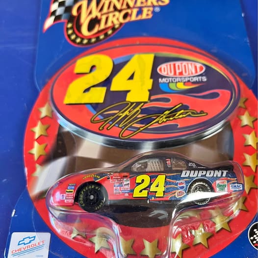 Diecast race car in blister package, red blue number 24
