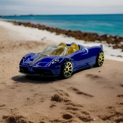 Blue 1:64 scale diecast roadster model car with gold seats and black front splitter