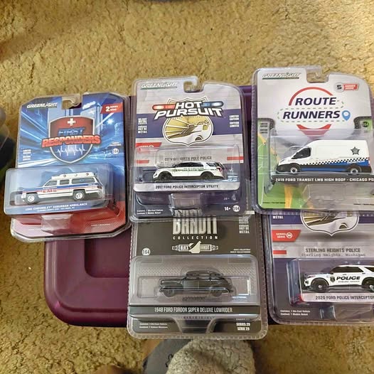 Boxed diecast car assortment in blister packs, police and race vehicles