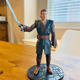 Disney diecast action figure of Anakin Skywalker in teal Jedi robe, holding lightsaber