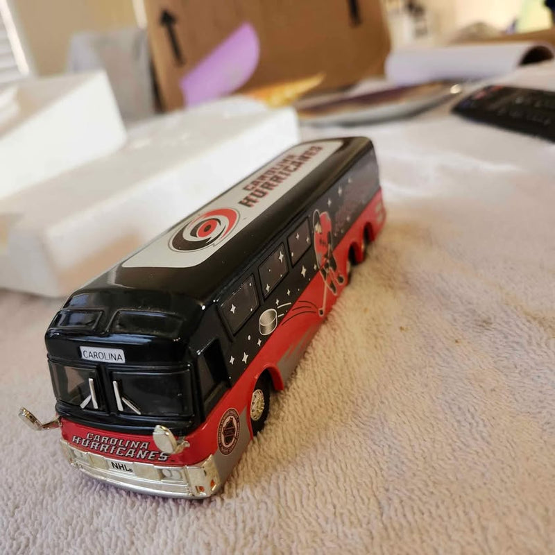 Carolina Hurricanes diecast motorcoach bus model, black with red team graphics