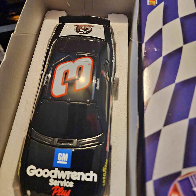 1:24 diecast race car with black body, orange number 9, and Goodwrench logo