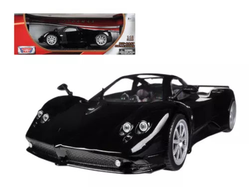 Black diecast model car with front 3/4 view, detailed grille and headlights