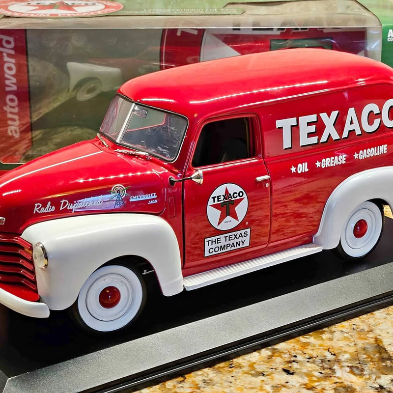 Red and white Texaco-themed diecast panel delivery car with whitewall tires