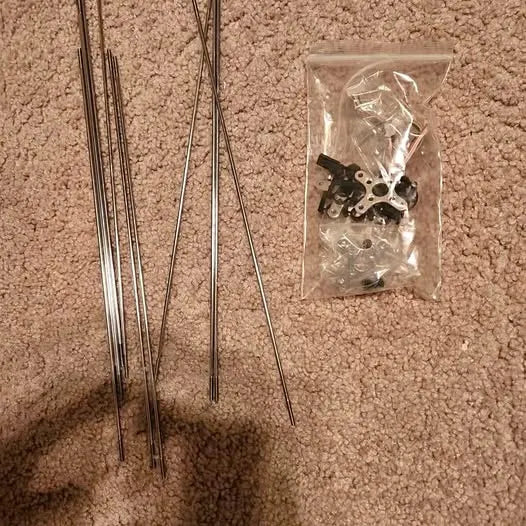 Drone push rods and accessories kit: metal rods and small hardware in clear bag